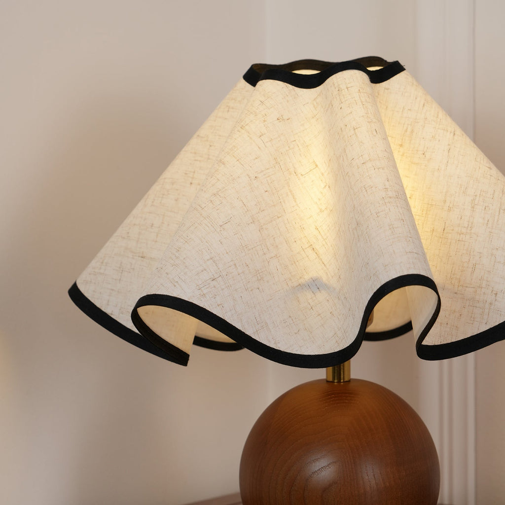 Wavecrest table lamp on a bedside surface in a soft-lit room