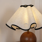 Wavecrest table lamp on a bedside surface in a soft-lit room