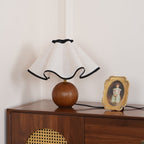 Wavecrest table lamp glowing in an evening interior setting