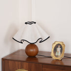 Wavecrest table lamp on a wooden surface in a styled room