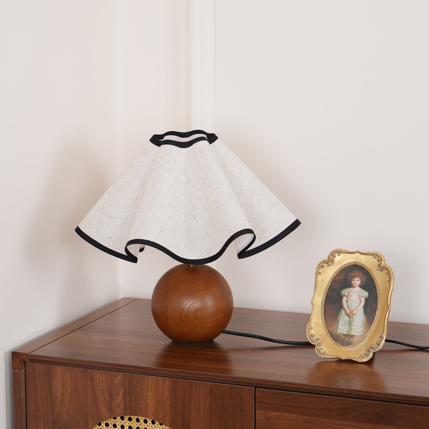 Wavecrest table lamp on a wooden surface in a styled room